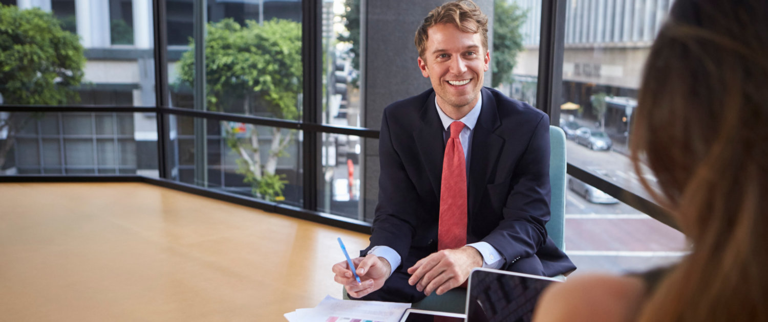 Young businessman and woman talking at an informal meeting