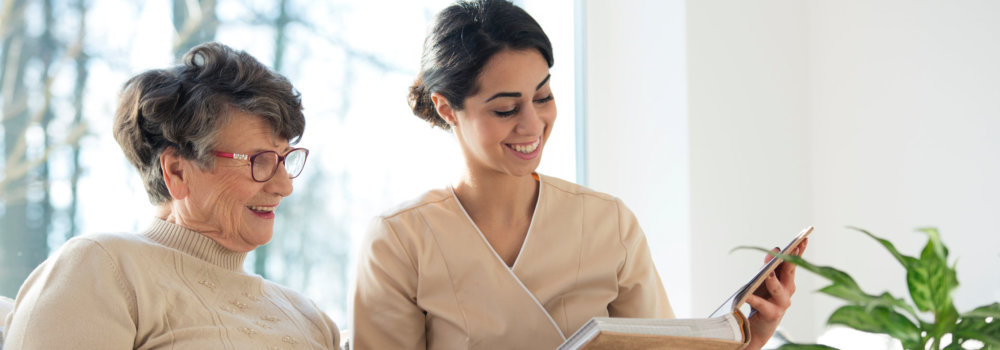 Caretaker with elder in room